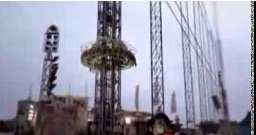 a blurry photo of a carnival ride at night