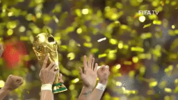 a group of people holding up a trophy