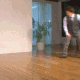 a blurry photo of a man standing in a living room