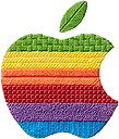 an apple with a green leaf on top of it