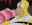 a cartoon character is sitting at a table