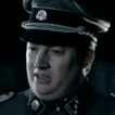 a man in a military uniform making a face