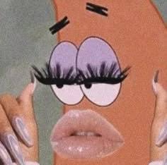a close up of a woman's face with fake eyelashes